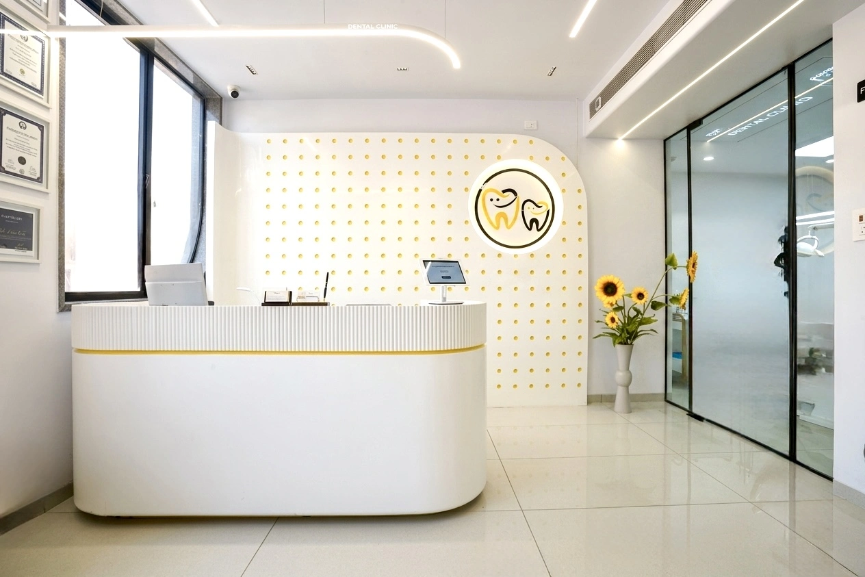 Bright reception and logo wall at Bhai-Bhai Dental Clinic