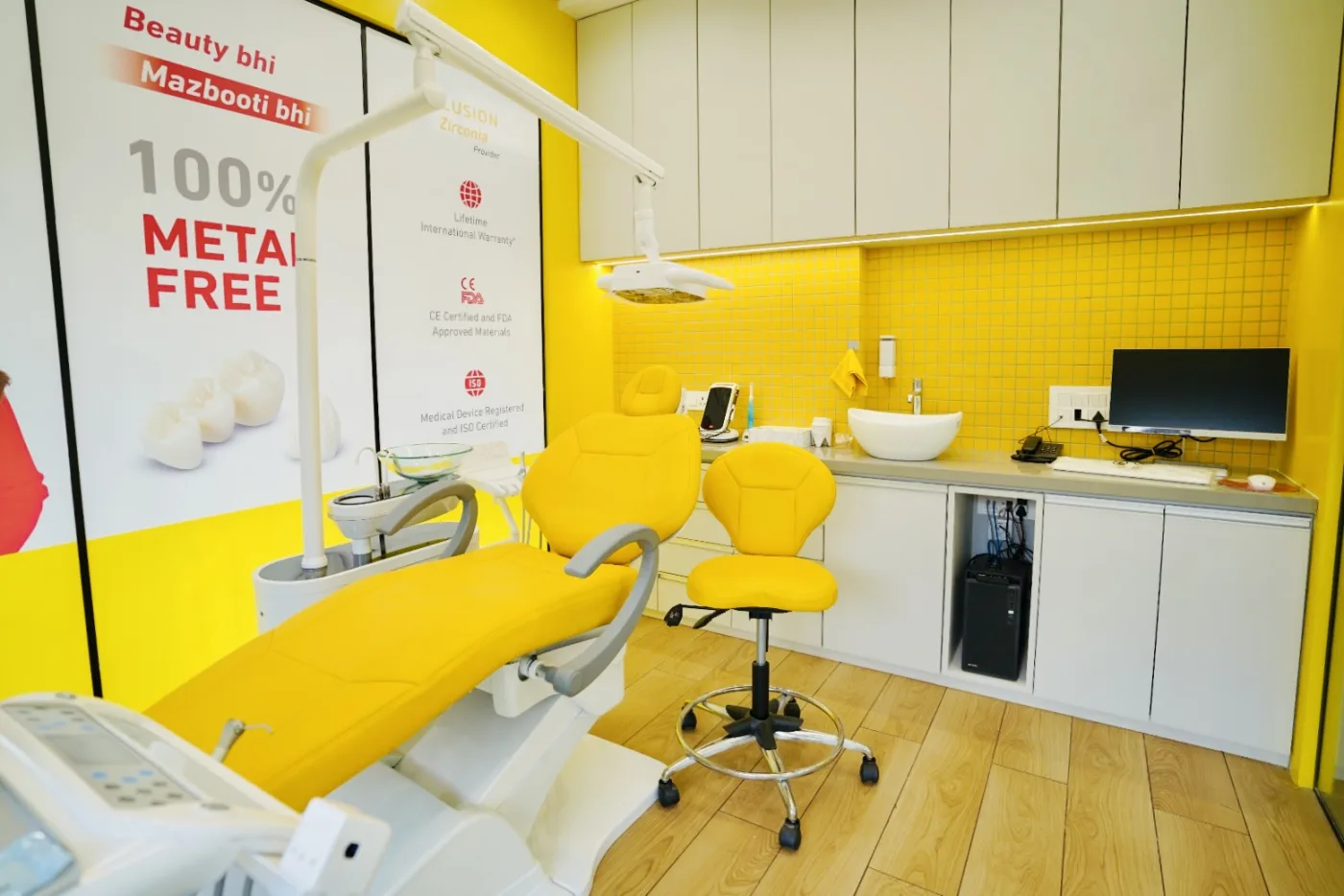 Modern yellow-and-white dental treatment room at Bhai-Bhai Dental Clinic