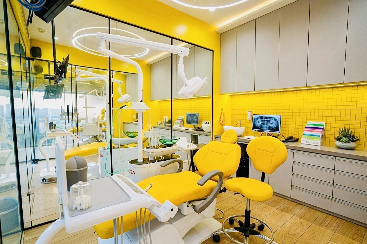 Modern yellow dental treatment suite at Bhai-Bhai Dental Clinic
